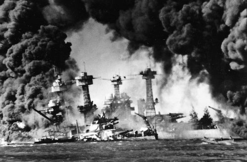 Battleship USS West Virginia sunk and burning at Pearl Harbor on Dec. 7, 1941. In background is the battleship USS Tennessee.